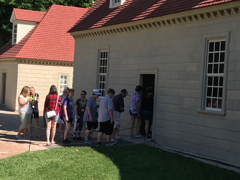 Line of students and staff entering a building at Mt Vernon