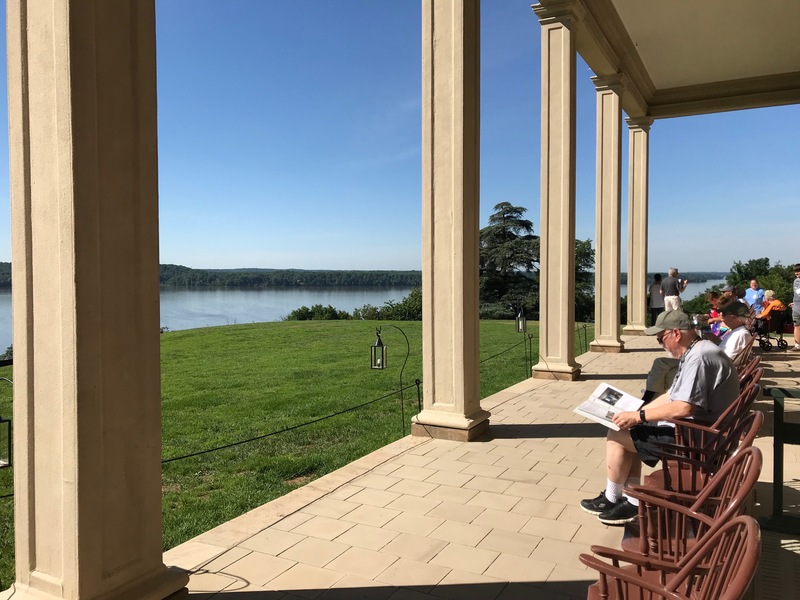 View from a covered porch overlooking a lake at Mt Vernon