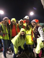 Students at a 'Neon Night' football game.