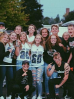 Students gathered at a football game.