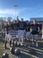 Cass City Football players with a 2019 Regional Champs sign.