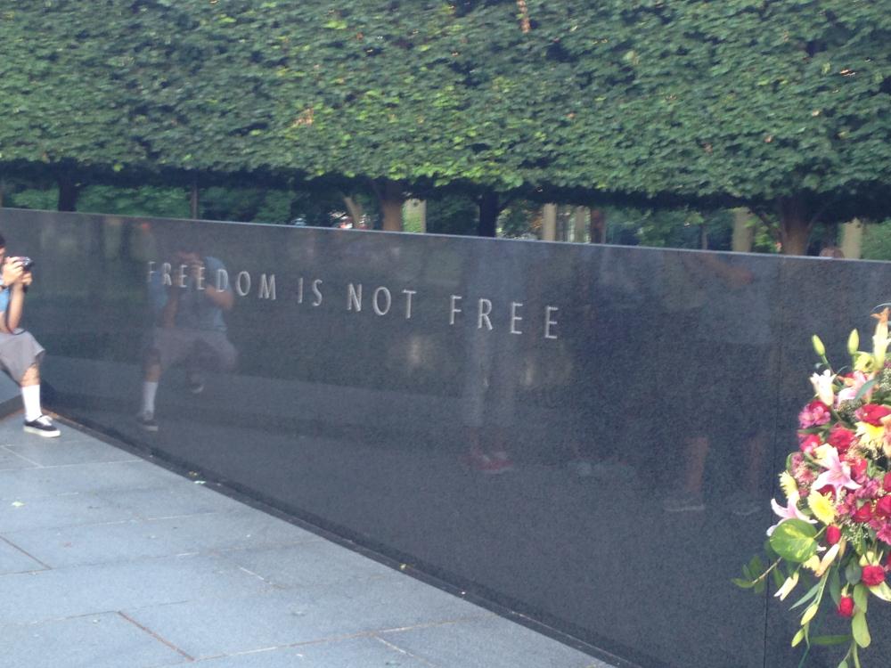 Freedom is not free printed on a wall